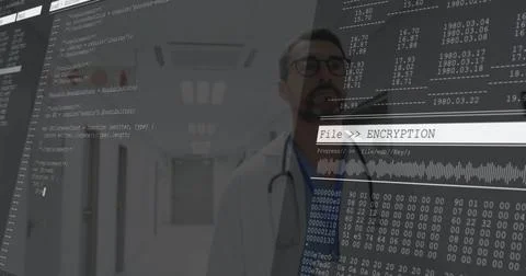 Standing doctor viewing code overlay in hospital hallway, with stethoscope, 스톡 사진