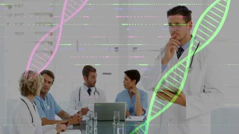 Standing dr using tab, leading med meet glass table, pink or green helix+glitch Stock Footage 329749939