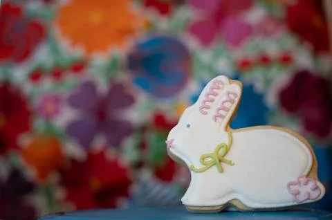 Standing Easter Bunny Cookie on a flower background  with Copy Space Stock Photos