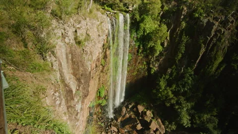 Standing at the edge of large waterfall lookout Stock Footage 152849741