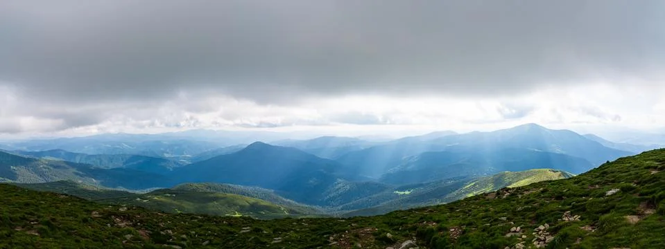 Standing empty on top of a mountain view with sunrays Stock Photos