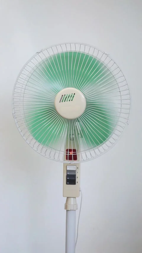 Standing fan on white background. Closeup on electric floor standing fan 動画素材 286102538