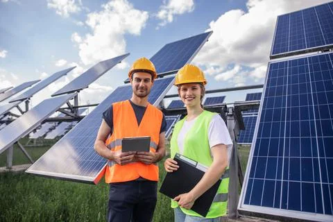 Standing in front of the camera two ecological engineers lady and man in the Stock Photos