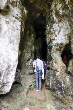 Standing in front of the cave Stock Photos
