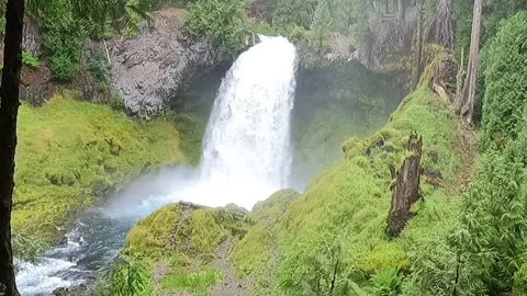 Standing in front of waterfall Stock Footage 294119146