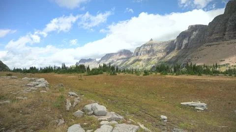 Standing on the Hidden Lake Trail looking down the Mount Oberlin range at Stock Footage 263693464
