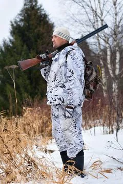 Standing hunter with gun Stock Photos