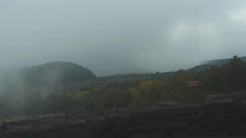 Standing inside big grey cloud on a mountain top. Low visibility in myst Stock Footage 102458373