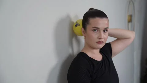 Standing Isometric Cervical Extension At Wall with Ball Stock Footage 314189544