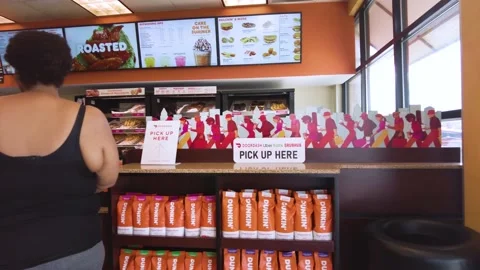 Standing in Line inside Dunkin Donuts Stock Footage 196528288