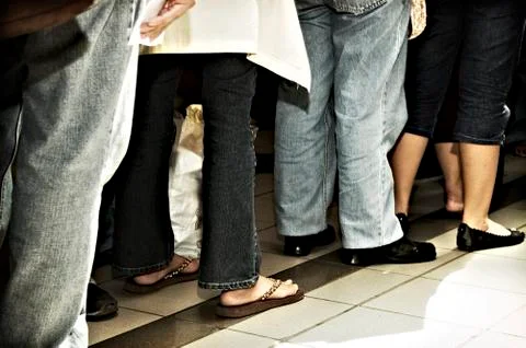 Standing in line Stock Photos
