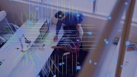 Standing man leaning, pointing, starting review as seated woman tapping laptop Stock Footage 334810886