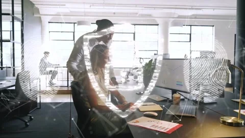 Standing man leaning pointing tab urging woman reading IT graphs verifying data Stock Footage 335739396