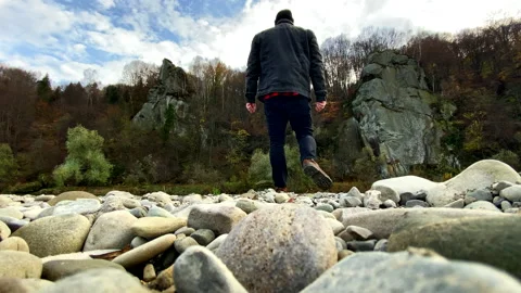 Standing man looking out over beautiful landscape during the fall season Stock Footage 220681273