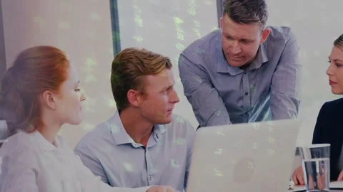 Standing man pointing at laptop, team leaning analyzing IT data with green Stock Footage 335235556