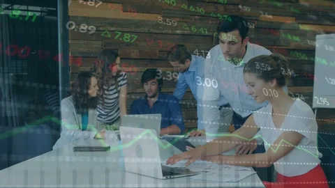Standing man pointing at tablet, team reviewing market data while typing as Stock Footage 335762077