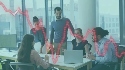 Standing man tapping laptop, leading team reviewing market data while red graph Stock Footage 334693816