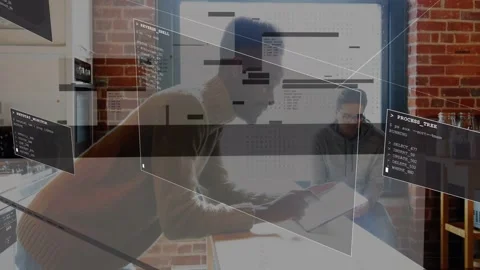 Standing man tapping tablet at counter, raising code overlays, seated man Stock Footage 333210790