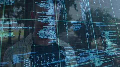 Standing man tilting head as blue code shifting on glass at plaza, wearing light Stock-Footage 332316542