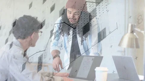 Standing mentor pointing at laptop, explaining tech charts as overlay guiding Stock Footage 333803192