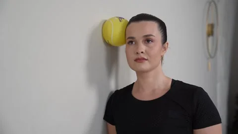 Standing Neck Isometrics Cervical Sidebending At Wall with Ball Stock Footage 314189681
