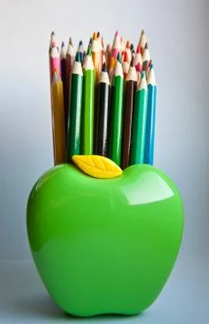 Standing out from the crowd concept with colored pencils. Stock Photos