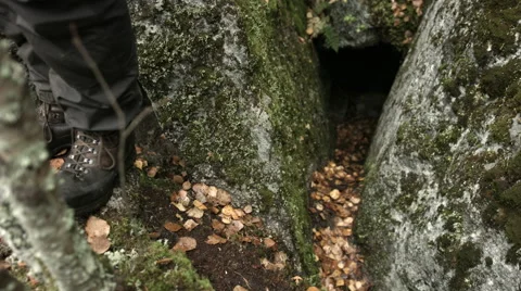 Standing outside a small cave Stock Footage 49583300