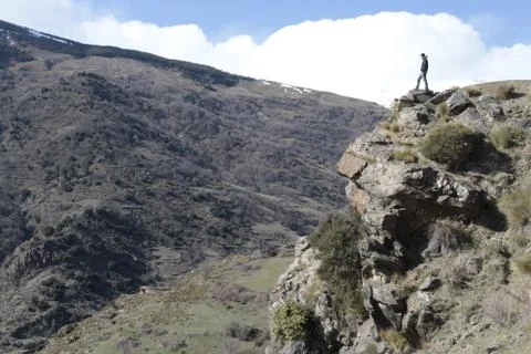 Standing over the cliff Stock Photos