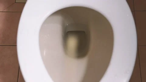 Standing peeing in bathroom. Video stock 134923518