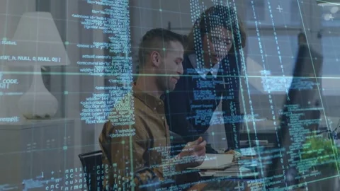 Standing peer leaning over, pointing at pages, guiding seated worker updating Vídeo Stock 334182808