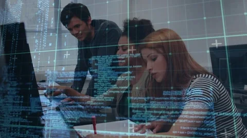 Standing peer pointing, center typing, right taking notes, code overlay showing Stock Footage 321783338