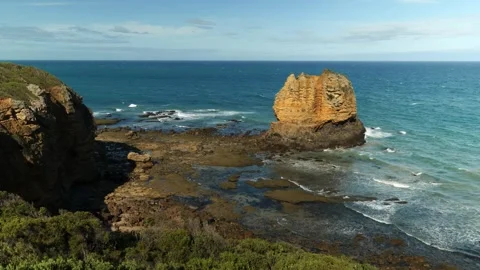 Standing rock on coastline Stock Footage 294464273