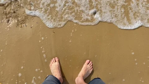 Standing on a sandy beach bare foot POV Stock Footage 280046375