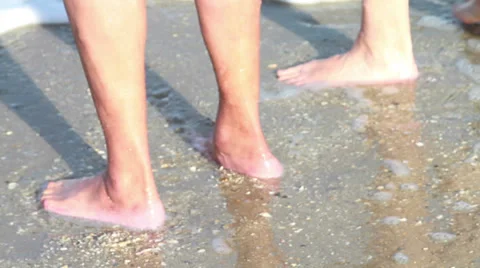 Standing on Sandy Beach with Ocean Waves Flowing Over Feet Stock Footage 34542536