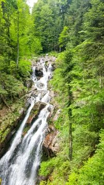 Standing side by side at the waterfall on the way to the top of the waterfall Stock Photos