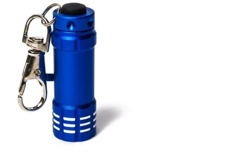 Standing Small blue flashlight key chain on white paper background Stock Photos