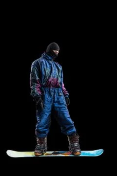 Standing snowboarder looking down isolated, rear view Foto stock