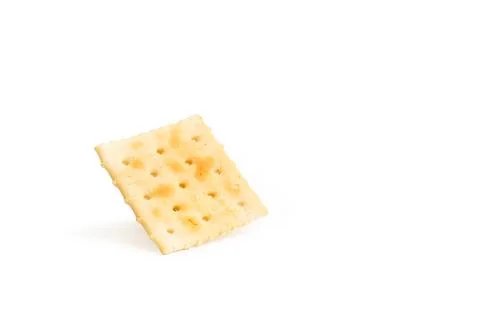 Standing square cracker biscuit on a white background Foto stock
