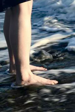 Standing in the surf Stock Photos