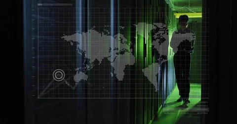 Standing tech wearing collared shirt in green server walkway, with racks and Stock Photos