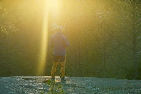Standing under sun light in forest. Foto stock