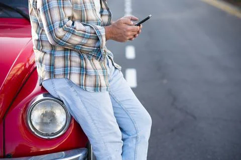Standing unrecognizable man using phone outdoor - unrecognizable people with  Stock Photos
