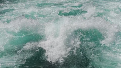 Standing wave in the Aare river and turbulent waters around it crashing Stock Footage 345619999