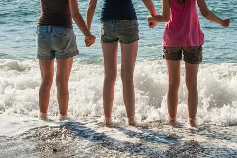 Standing in the waves Stock Photos