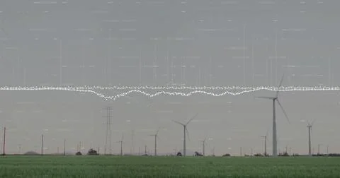 Standing white wind turbines lining grass field, with pylons, power lines, Ilustração Stock