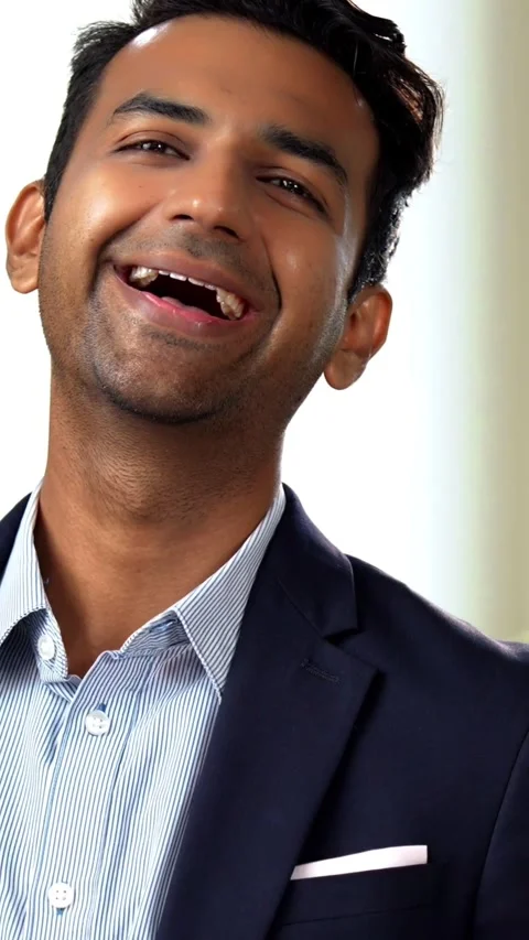 Standing at window with coffee mug, Indian coworkers chat during office break Stock-Footage 342559854