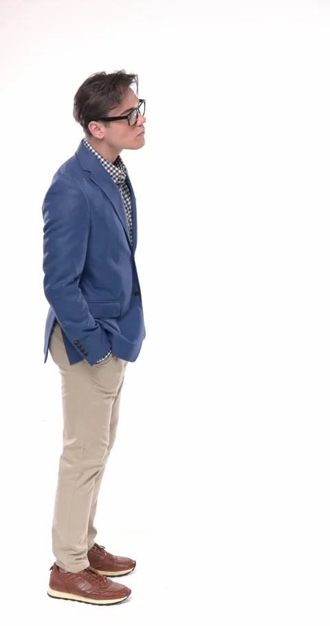 Standing young man with glasses holding hands in pockets, waiting in line, Stock Footage 310043648