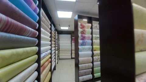 Stands with rolls of wallpaper Samples in store Stock-Footage 91141544