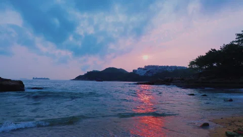 Stanley Beach in Hong Kong at Sunset with Waves Reaching the Shore Stock Footage 343774586