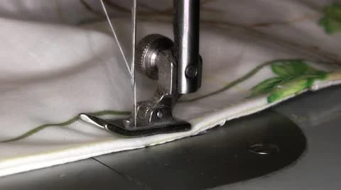 Staple the edge of the sheets on the sewing machine Stock Footage 16316645